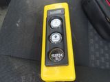 a remote control sitting on the seat of a car
