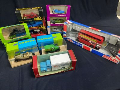 many different types of toy trains and trucks in the box