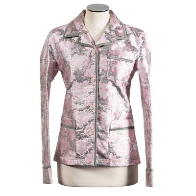 a women ' s pink jacket with a floral pattern on the front