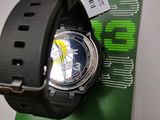the watch is sitting on top of a piece of circuit board