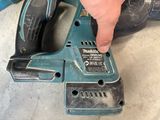 someone is using a cordless drill to cut a hole in the floor