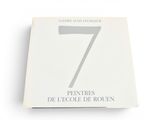 the book is on a white surface with a white background