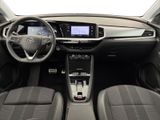 the interior of a car with a steering wheel, dashboard, and dashboard controls