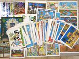 a lot of cards that are laying on the floor