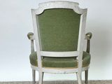 an old chair with green upholstered upholstered upholstered upholstered upholstered up
