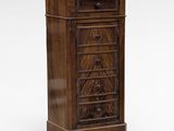 an antique wooden chest of drawers with a marble top
