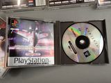 a cd in a case on a table next to other cds