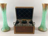 two vases sitting next to each other on a table