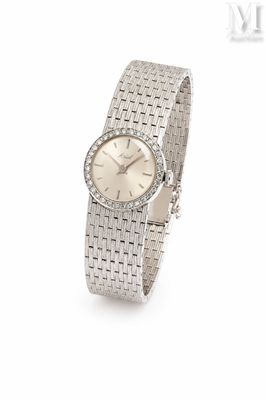 an image of a lady ' s wrist watch with a diamond set bezel