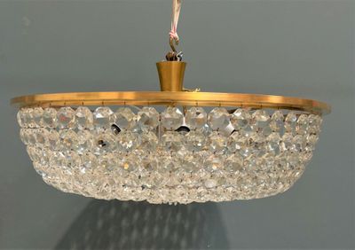 a chandelier hanging from the ceiling in a room