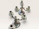 four candles that are sitting on a table