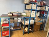 a room with a lot of boxes and boxes on the shelves