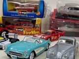 several toy cars are lined up in a row on a table