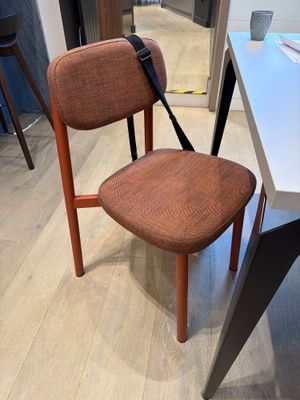 a chair that is sitting on the floor next to a table