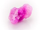pink crystals on a white surface with a white background