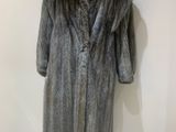 an image of a fur coat on a mannequin stand