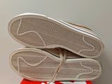 the soles of a pair of shoes are on top of a box