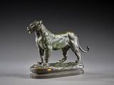 an image of a bronze statue of a lion on a marble base