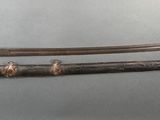 two swords that are on display on a table