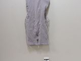 a picture of a dress on a hanger next to a toothbrush