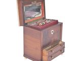 a small wooden box with a mirror on top of it