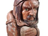 a statue of a man with a hat and a beard