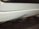 a close up of a white car with a black seat
