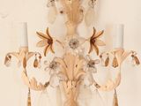 a wall sconce with two candles on it