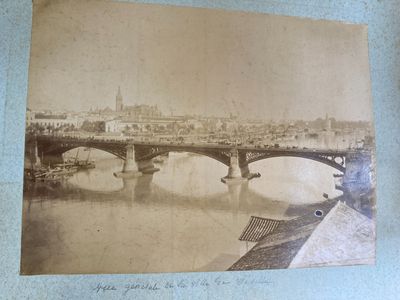 photograph of an old picture of a bridge over a river