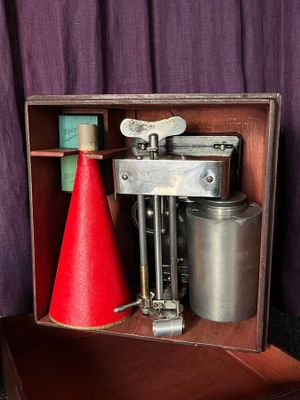 a red cone sitting on top of a wooden box