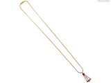 un collier en or orné d'une perle rouge et blanche