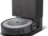 an image of a robotic vacuum cleaner with a box on top of it