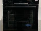 an image of a black oven with the door open