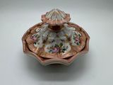 an image of a small bowl with a lid and flowers on it