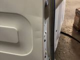 an image of a washing machine with a hose attached to it