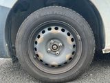 a white van that has a flat tire on it