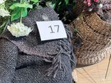 many baskets of flowers on the table with a price tag