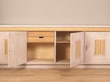 an image of a wooden cabinet with doors open on a hard wood floor