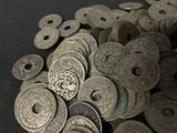 a pile of silver coins sitting on a table