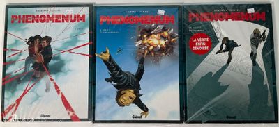 trois livres posés sur une table