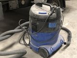 a machine that is sitting on the ground in the garage