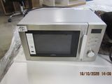 a microwave that is sitting on top of a table
