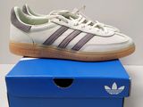 a pair of adidas sneakers on top of a blue box