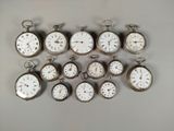 many different types of pocket watches on the table