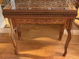a small table with a drawer on top of it