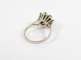 a close up of a ring on a white surface