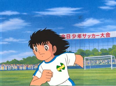 image de bande dessinée représentant un jeune garçon courant vers un ballon de foot