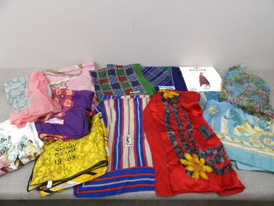 many different types of clothing laid out on a table