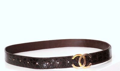 a picture of a black belt with a gold buckle