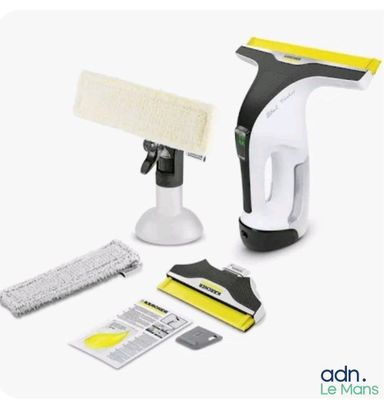 a white and black vacuum and cleaning supplies on a white background